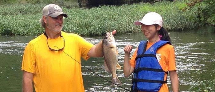 host parent with exchange student fishing