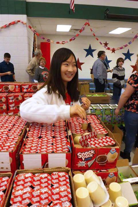 exchange student volunteering at food pantry