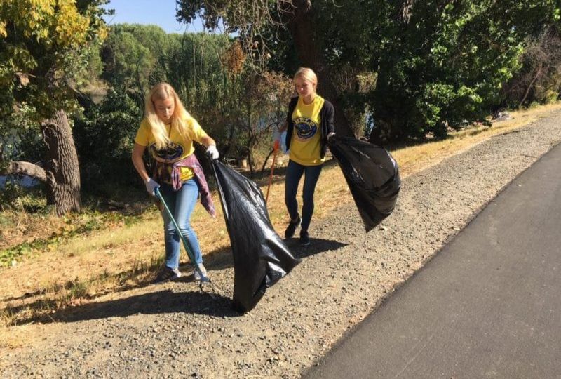 Foreign exchange students volunteering for highway clean up