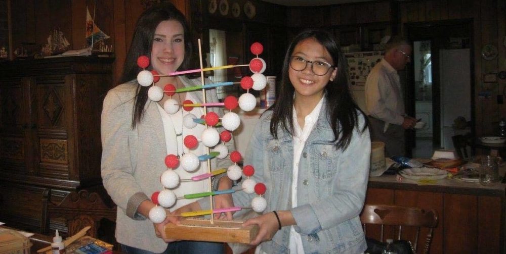 Exchange students making science project