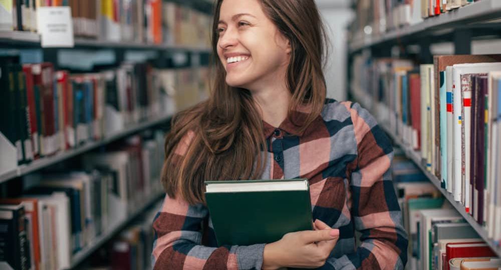 student in library