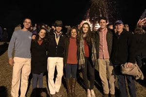 host family at a bonfire with their exchange student