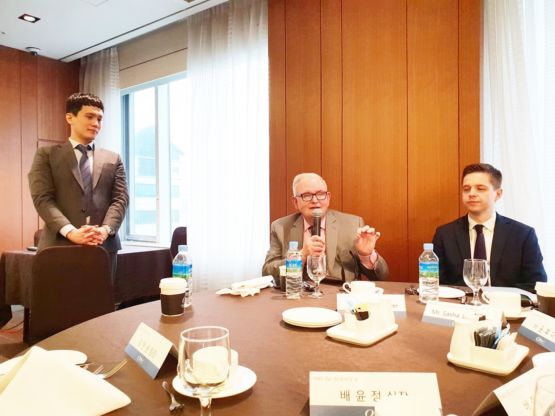 Overseas Partner Meetings CEO Wayne Brewer speaking at an international partners meeting