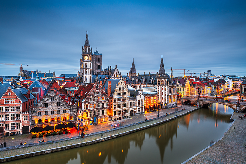 Ghent, Belgium old town cityscape from the Graslei area at dusk.