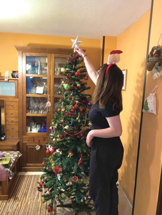 Jaiden adding star to Christmas Tree in Spain